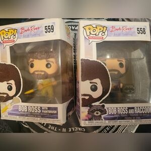 FUNKO POP Bob Ross × 2 Collectible Figures - 558 w/ Raccoon & 559 w/ Paintbrush